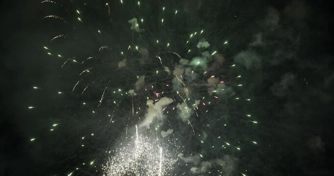 Cascading Green and White Sparks Fill Frame in Night Sky Above Provo, Utah