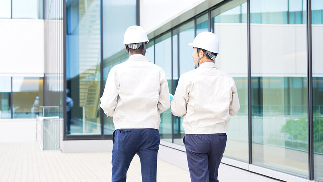 A group of multinational engineers walking through a building.