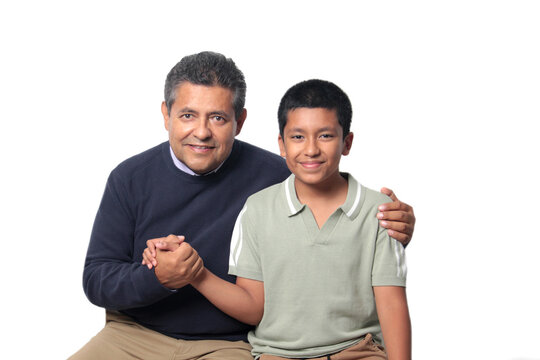 Latino single dad and his 12-year-old Latino son show their love to celebrate Father's Day