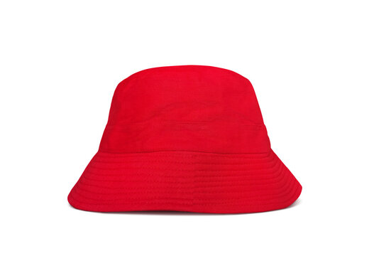A bright red bucket hat lies on a white floor.