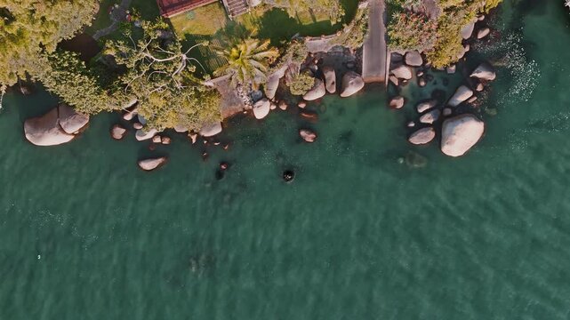 Top-Down Drone View of Coastal Village and Small Boat in Florianopolis
