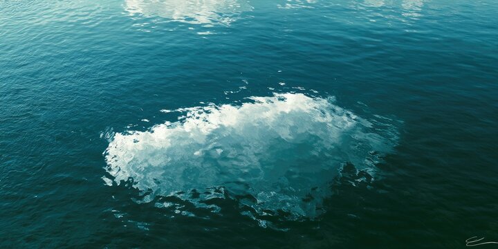 Rippling blue water with a bright white frothy wave crest