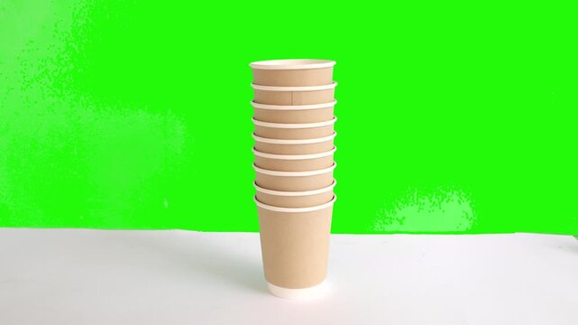 4K video of disposal paper cup stack animation on green screen background. 