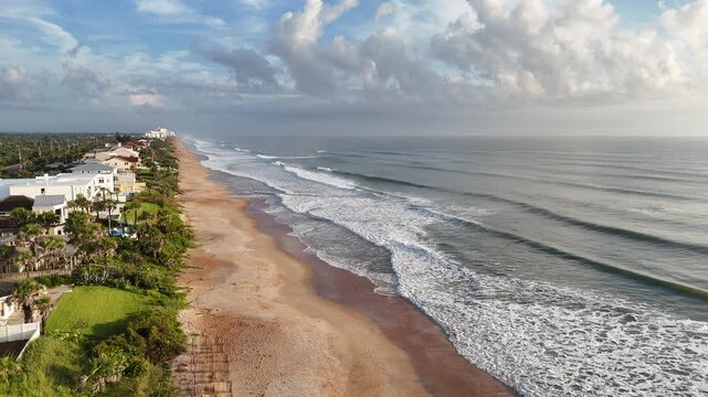 Beautiful morning with waves breaking along the coastline at Ormond Beach in Volusia County, Florida