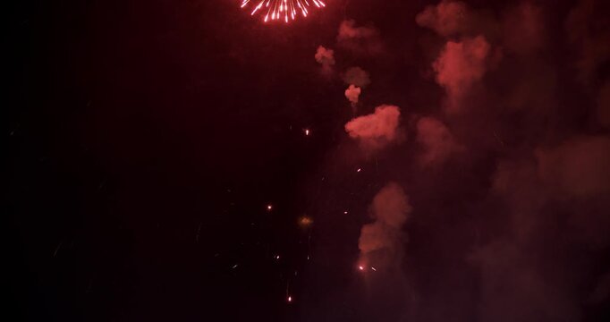 Firework Burst Trailing Sparks Against Smoke-Filled Night Sky In Provo Utah