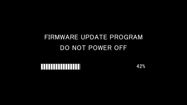 Video of loading progress bar with on-screen text firmware update program do not power off on black background