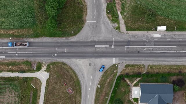 Aerial drone view of a rural road intersection, showing multiple paths and choices for travel.