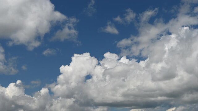 Thick white and grey clouds fill the sky, creating an impression of changeable weather.