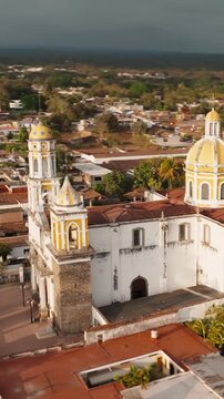 Aerial orbiting hyperlapse of Parroquia de San Miguel Arc&aacute;ngel church in Comala, Mexico