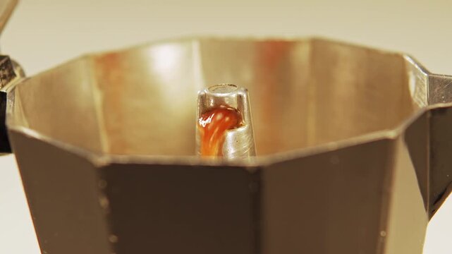 Espresso pouring from italian moka pot
