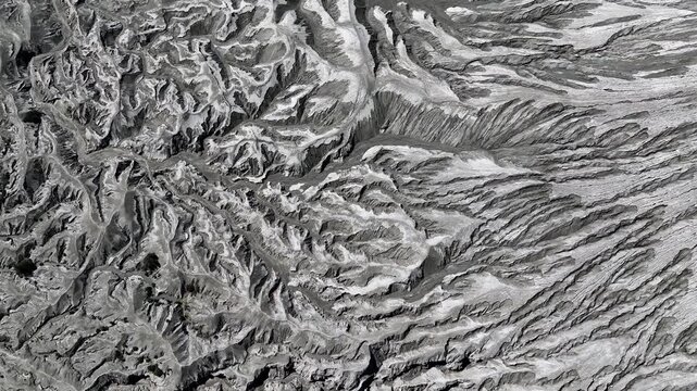 Aerial shot of abstract volcanic landscape and eroded texture on Mount Bromo, Indonesia.