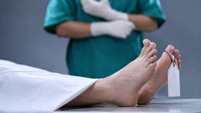 Dead Body with Toe Tag on Morgue Table, Forensic Pathologist Standing Behind, Autopsy and Mortuary Concept
