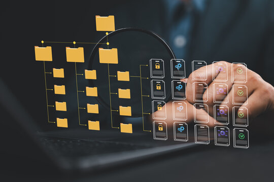 Document management system DMS and version control.Folder structure and classification system. File and folder icons. Businessman using laptop computer.