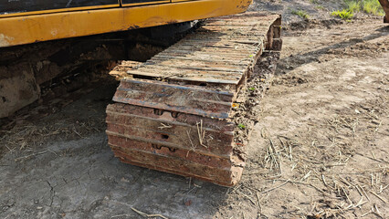 Fototapeta premium Excavator engines. Excavator undercarriage parts. Backhoe.