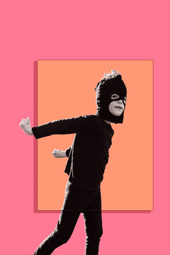 Ninja. Graphic design poster of a happy, confident young boy posing in a Ninja costume with a handmade mask made from black panty hose stocking; Australia