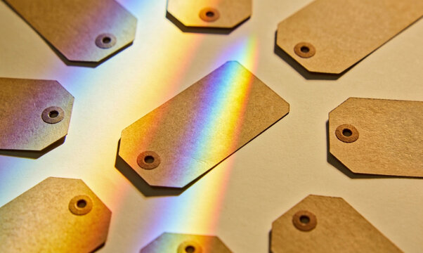 A speculum of light that shines above the brown empty tags placed on the floor