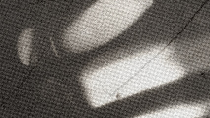 Fototapeta na wymiar Cinematic film grain texture with soft light leaks, vintage analog photography aesthetic on dark background, grainy noise overlay for retro video editing and nostalgic creative design work.