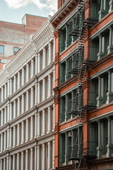Obraz premium Soho & Chinatown Street Photography in Manhattan, New York City. Rich details of Iron casted Facade of old New York. Historic and modern architecture of NYC.