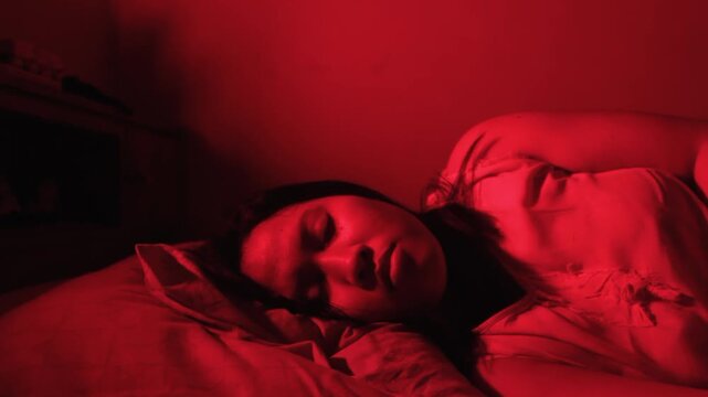 Disturbed scared woman waking up from night terror in bed late in dark bedroom. Nightmare anxiety, Bad dream