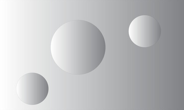 Spheres of varying sizes are positioned on a smooth grey gradient background.