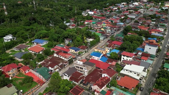 Top view aerial shot of CJDC Building in Barangay Poblacion III Alfonso Cavite Philippines revealing the lot layout, roof structure, and nearby road network.