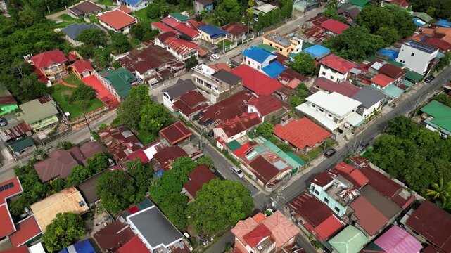 Wide cinematic panorama of CJDC Building and nearby commercial establishments in Alfonso Cavite Philippines featuring the town proper and visible road corridors.