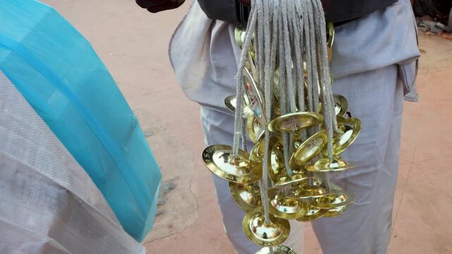 Street Vendor Selling Traditional Manjira Cymbals Near Pilgrimage Site in Ayodhya