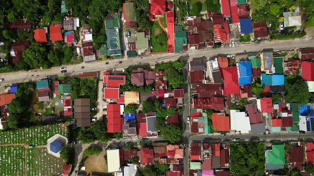 Atmospheric aerial shot of the CJDC Building district in Barangay Poblacion III Alfonso Cavite Philippines showcasing a recognizable roadside business location within the town center.