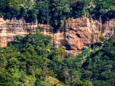 Panoramic view of a massive geological sandstone formation surrounded by lush tropical green foliage at the Itambe valley in Marilia, Sao Paulo, Brazil. 