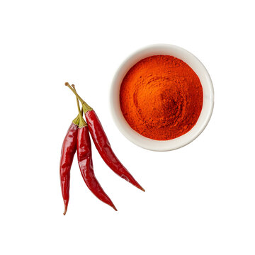 Red chili peppers and bowl of chili powder spice isolated on white background for culinary use in cooking and recipe preparation