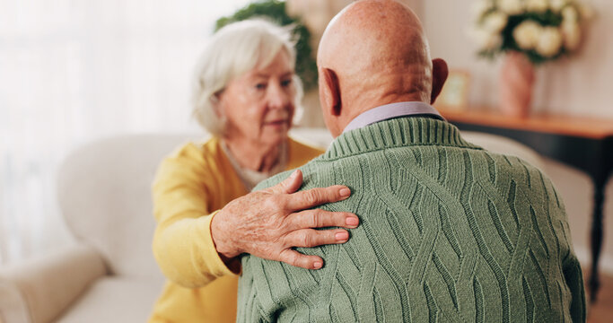 Comfort, hand and shoulder with old people in home living room for bonding, support or wellness. Consoling, empathy and love with senior friends in apartment together for grief, loss or pain