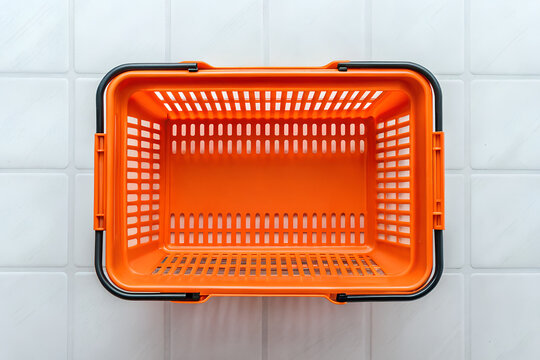 Overhead view of a vibrant Orange plastic shopping basket on png, shopping basket, Orange basket, plastic basket, store basket, supermarket, shopping container, retail, grocery, market, container