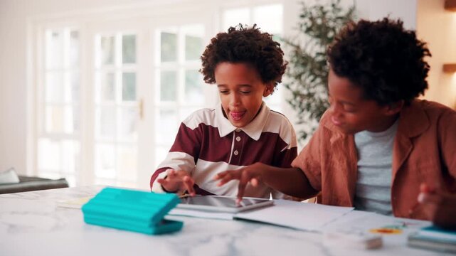Education, scrolling and tablet with children in home for development, homework help or learning. App, search and study with African boys at counter in apartment or assistance or school assignment