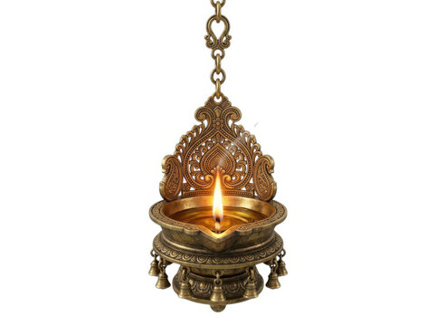 Traditional brass diya oil lamp hanging on a chain with glowing flame for diwali