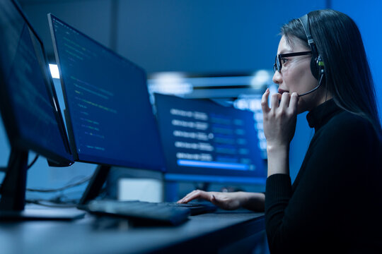 Customer service, asian female IT support engineer wearing headset working on computer code, technical helpdesk, call center, software development, cybersecurity and global corporate communications