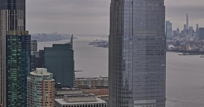 Jersey City New Jersey Aerial v23 zoomed drone flyover Hudson river capturing waterfront skyscrapers and NYC Manhattan cityscape on an overcast day - Shot with Mavic 3 Pro Cine - September 2023