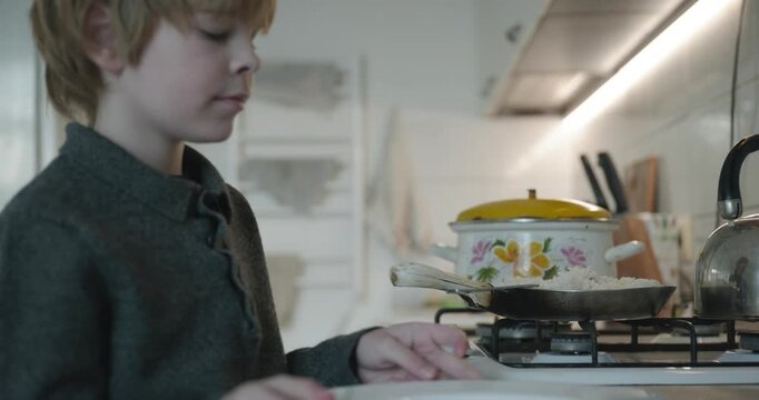 Kid Boy Eat Rice and Sausage. Eating Breakfast Lunch in Kitchen. 4K 10-bit
