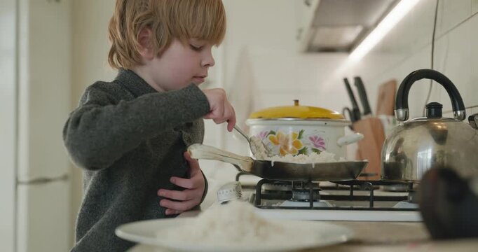 Kid Boy Eat Rice and Sausage. Eating Breakfast Lunch in Kitchen. 4K 10-bit