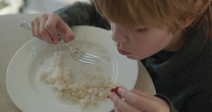 Kid Boy Eat Rice and Sausage. Eating Breakfast Lunch in Kitchen. 4K 10-bit