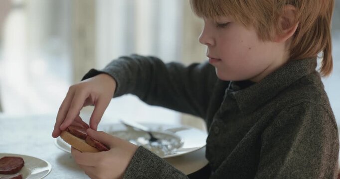 Kid Boy Eat Rice and Sausage. Eating Breakfast Lunch in Kitchen. 4K 10-bit