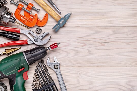 Tools and Hardware Spread on Wooden Workbench.