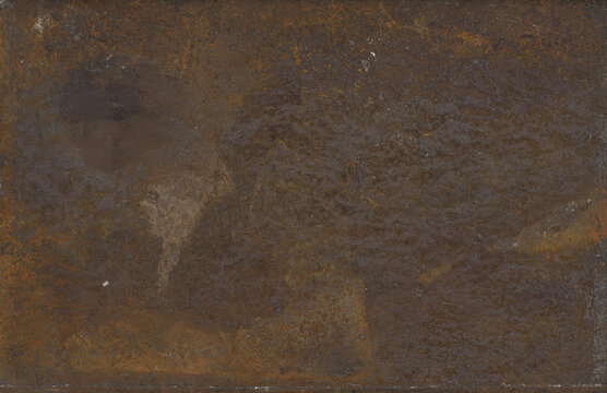 Close up view of distressed rusty metal sheet, showing corrosion, pitting, and varied tones of brown, orange, and gray.
