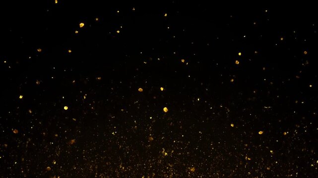 Golden glitter particles floating on black background, luxury abstract motion overlay