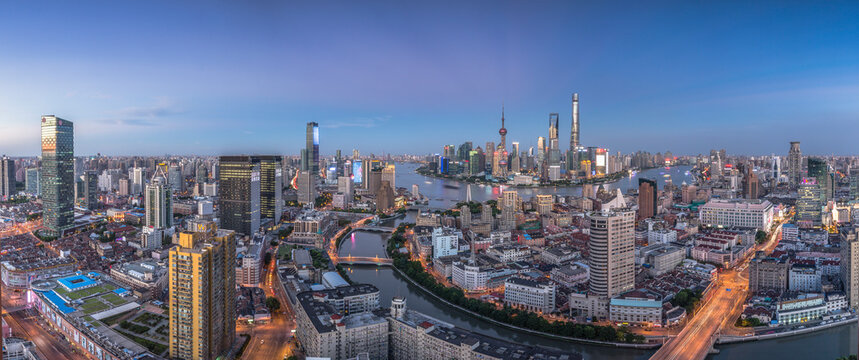 Shanghai Pudong Skyline at Dusk with Huangpu River and Modern Skyscrapers