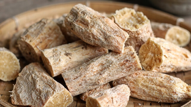  Traditional Steamed Cassava Root Pieces Served in a Woven Bamboo Basket