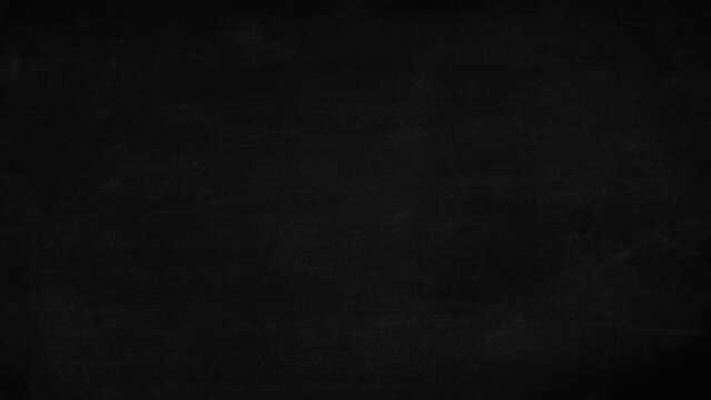 Blank black chalkboard texture provides dark school board background for educational designs and classroom presentation templates.