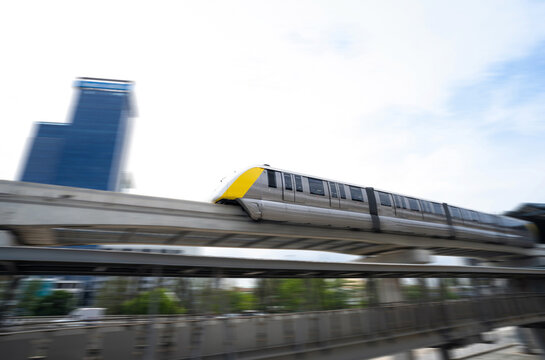 Elevated monorail train fast move on rail. Public transit monorail. Modern mass transit. Rail transportation. Driverless straddle monorail. Monorail technology. Rapid transit in city. Urban transport.