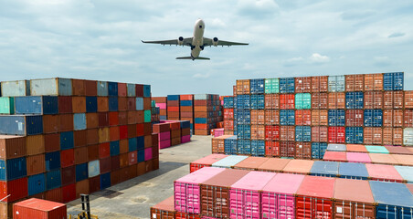 Airplane flying above container logistic. Container crisis. Freight transportation. Logistic industry. Container ship for export logistics. Container at the harbor for truck transport. Air transport. © Fahroni