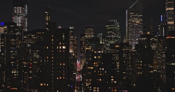 NYC New York Aerial v170 cinematic low tracking shot, drone flyover East river capturing bustling Midtown Manhattan and modern skyscrapers cityscape at night - Shot with Inspire 3 8k - September 2023