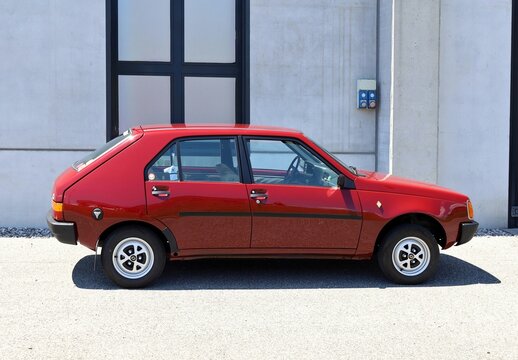Azzida, Italy. July, 4 2026 Side view of red Renault 14, Seventies small family car, during a collector's car&nbsp; gathering. Its nickname was 'the Pear'